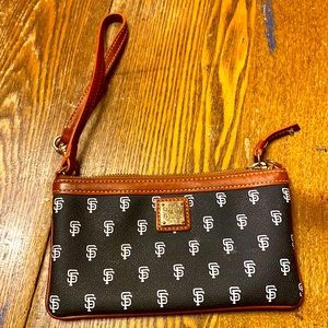 Navy blue and white Dooney &Bourke SF Giants wristlet. Great condition.